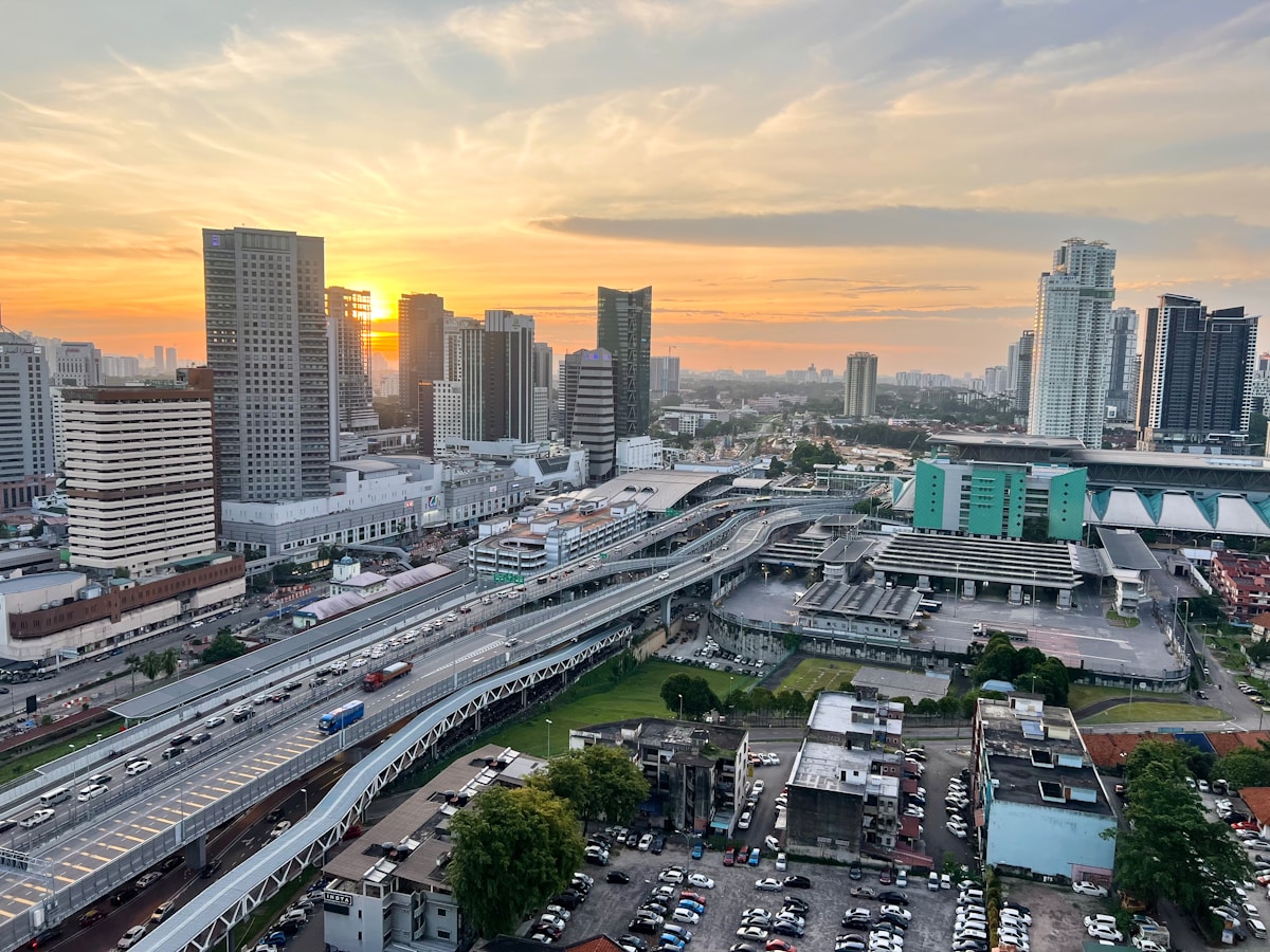 Johor Bahru waterfront with the Johor Strait and Singapore skyline visible across the water