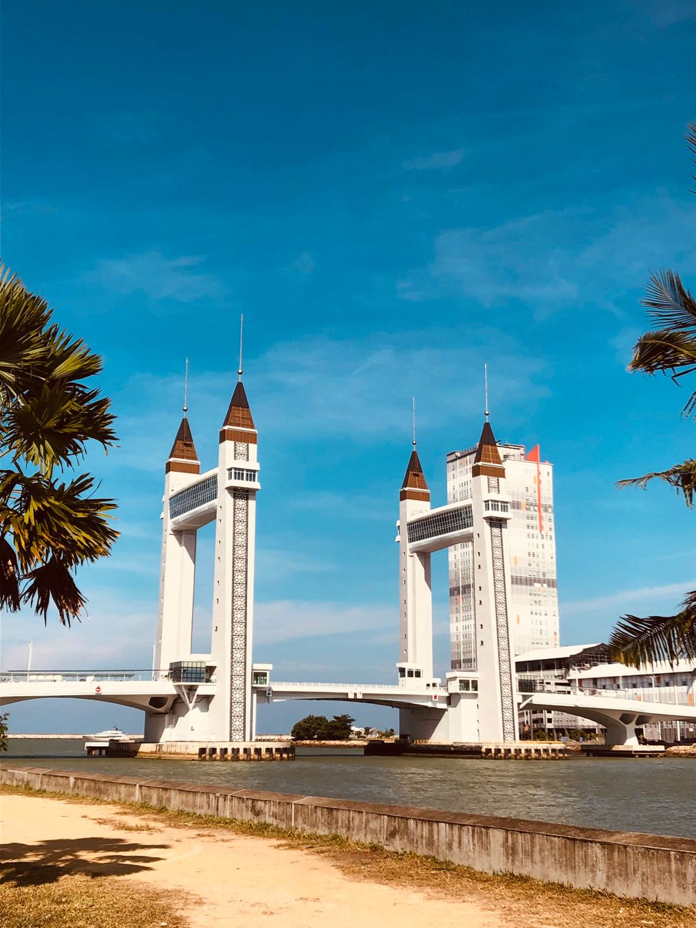 Terengganu Drawbridge bascule bridge with palm trees under blue sky, Kuala Terengganu, Malaysia