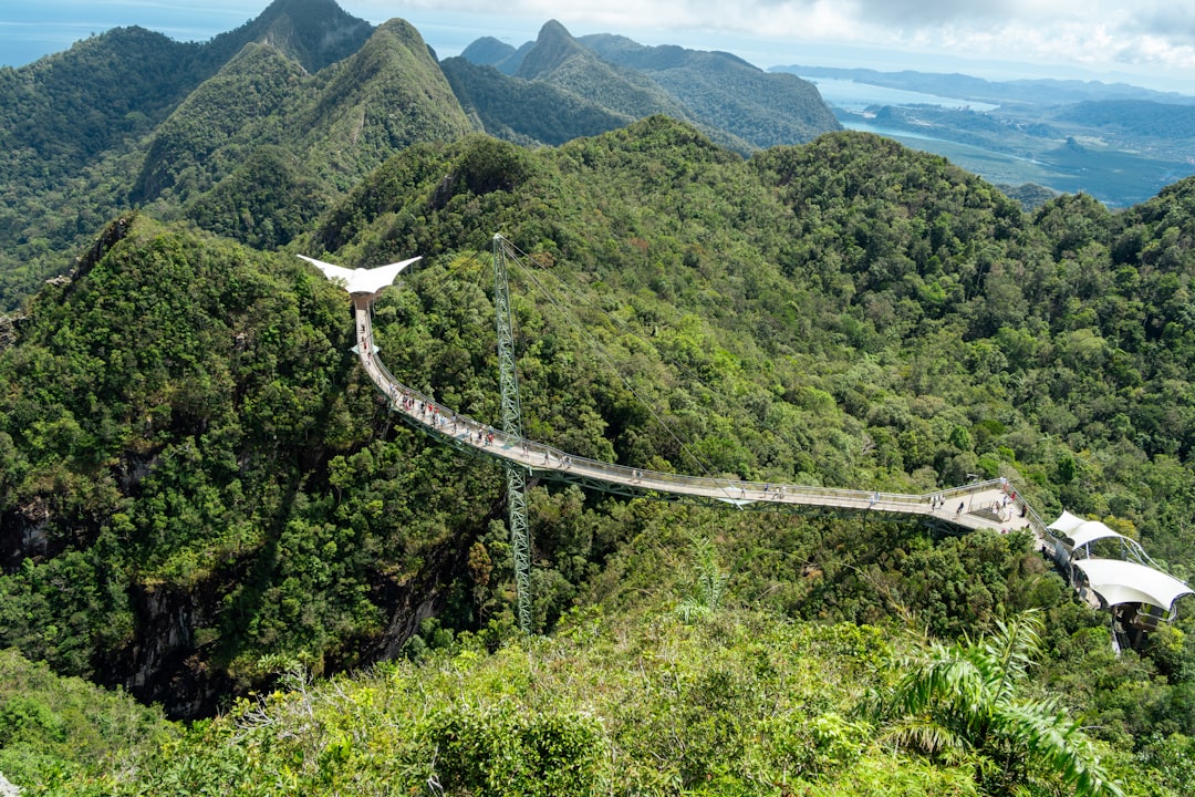 Aerial view of the Langkawi Sky Bridge spanning across jungle mountains in Kedah, Malaysia