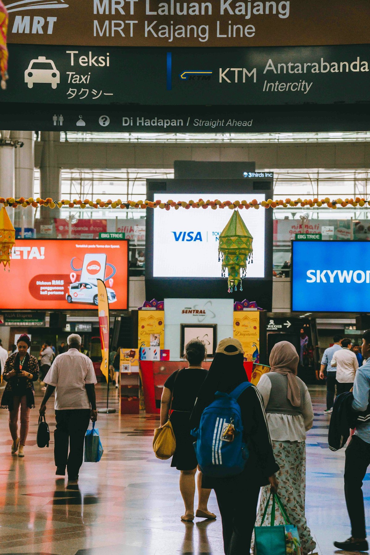 Group of people walking through an airport, Kuala Lumpur, Malaysia