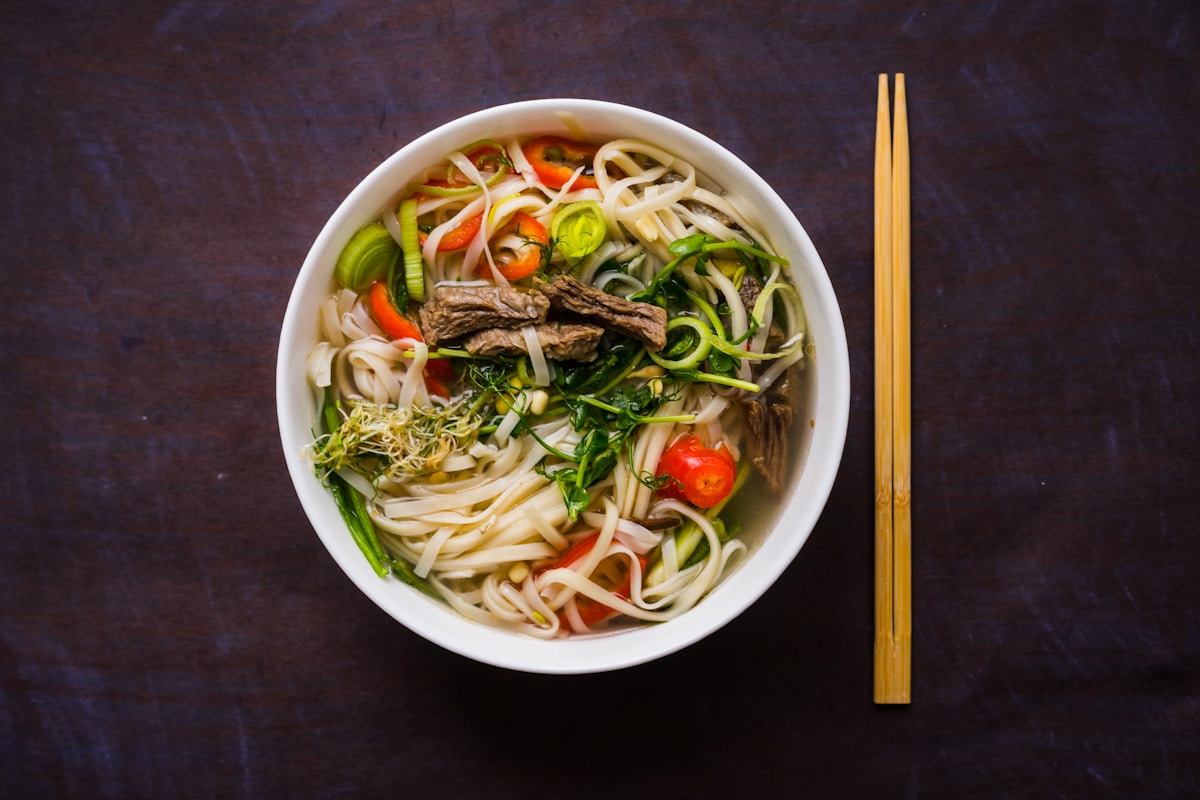 Bowl of laksa noodle soup with toppings, Malaysian street food