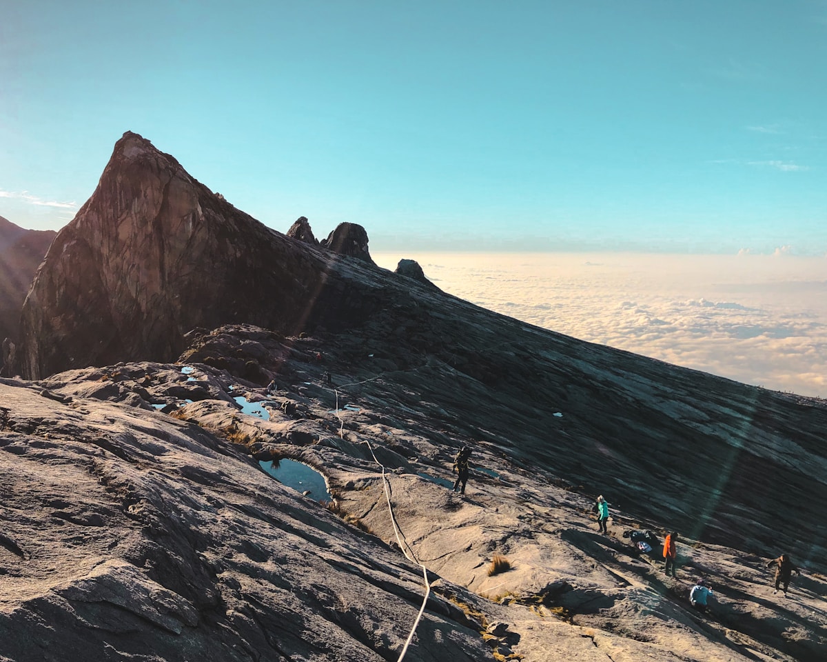 Granite summit plateau of Mount Kinabalu above the clouds at sunrise, Sabah, Malaysia