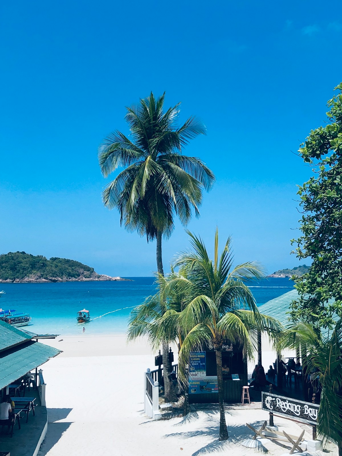 Small island in ocean under cloudy sky, Sabah coast, Malaysia