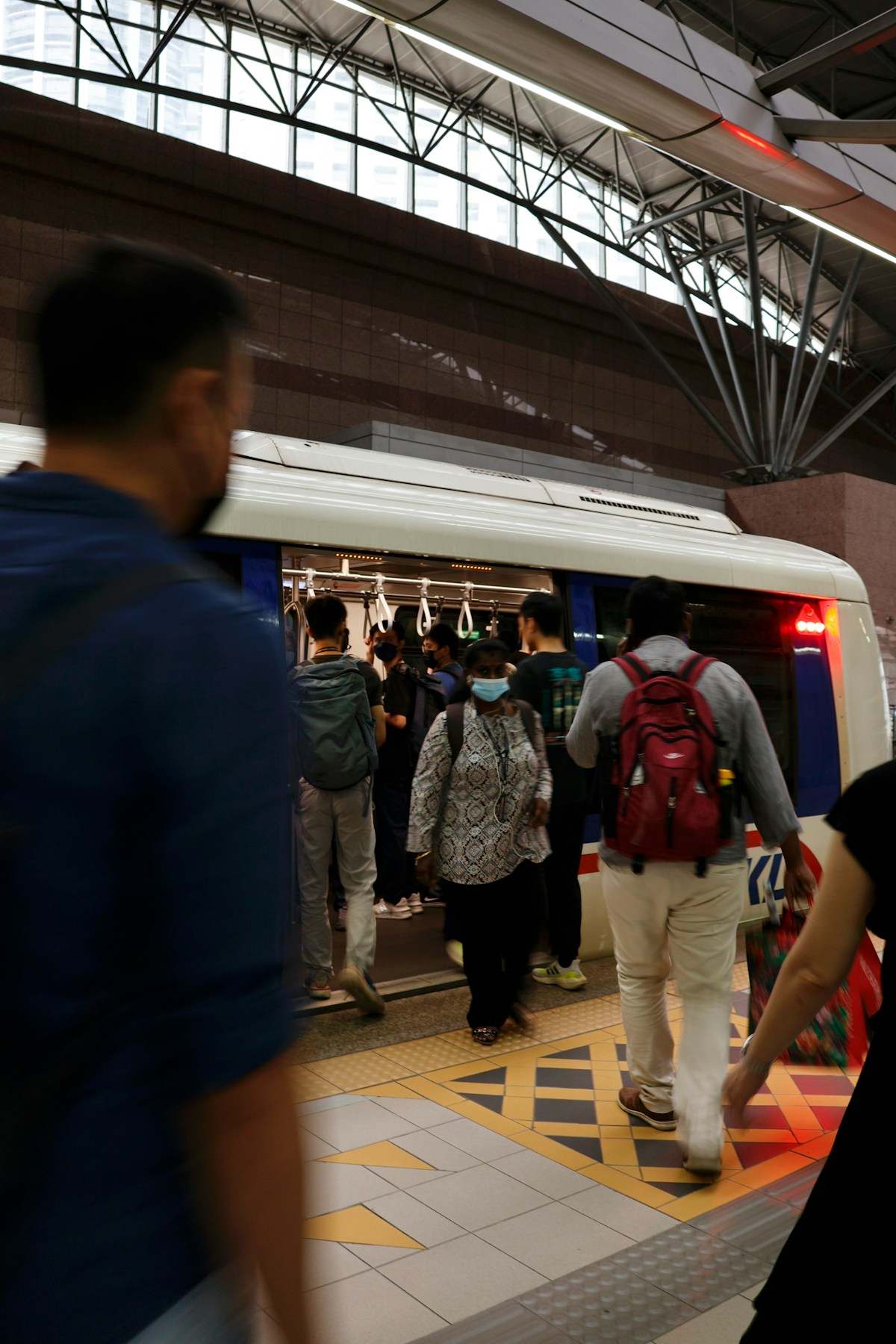 Passengers boarding a train at KL Sentral station, Kuala Lumpur, Malaysia