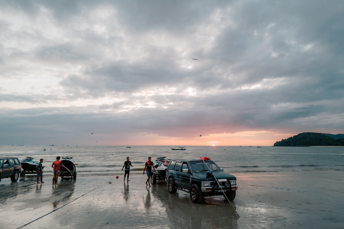 Group of families on a sandy beach, Langkawi, Malaysia — family travel guide