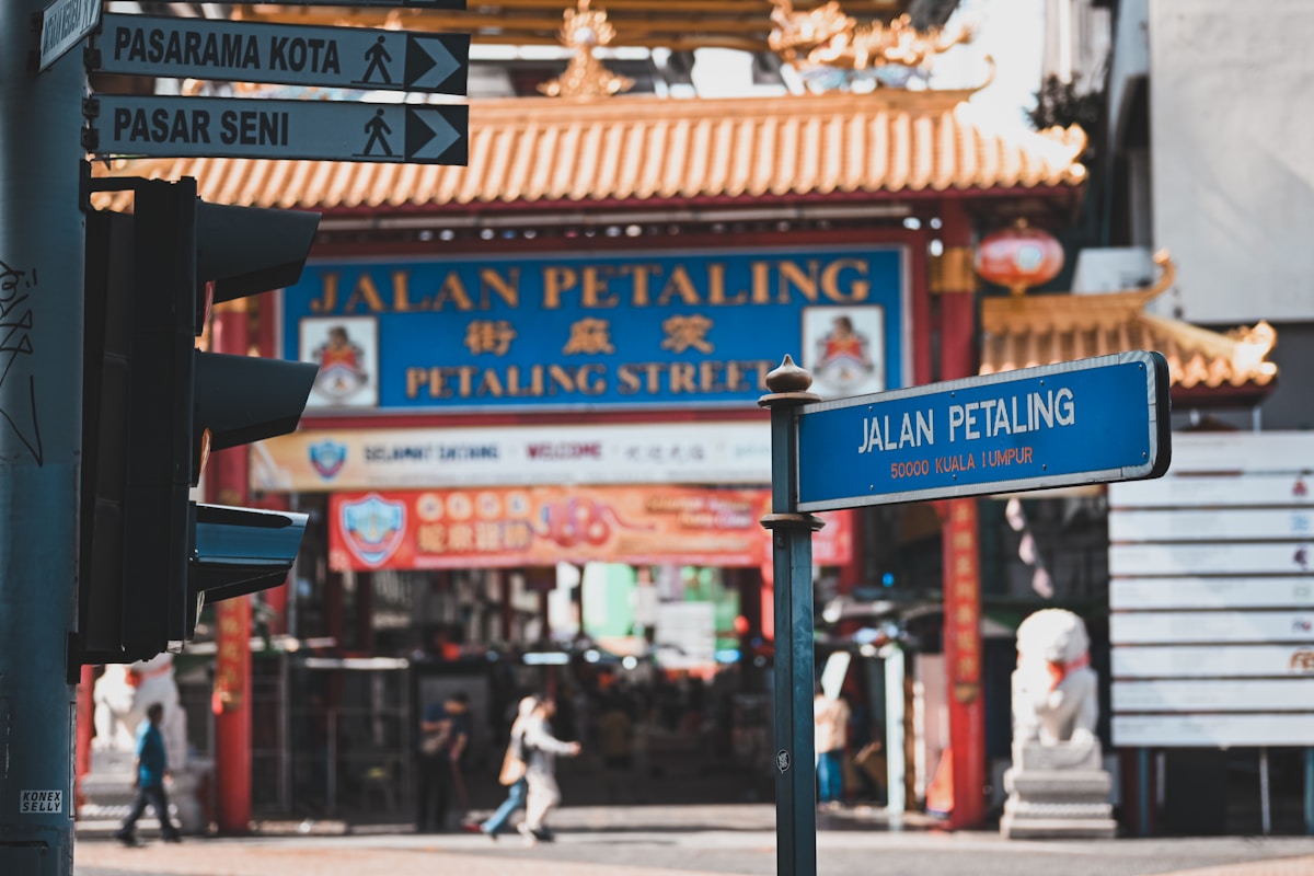 Jalan Petaling street sign with Chinese archway, Chinatown, Kuala Lumpur
