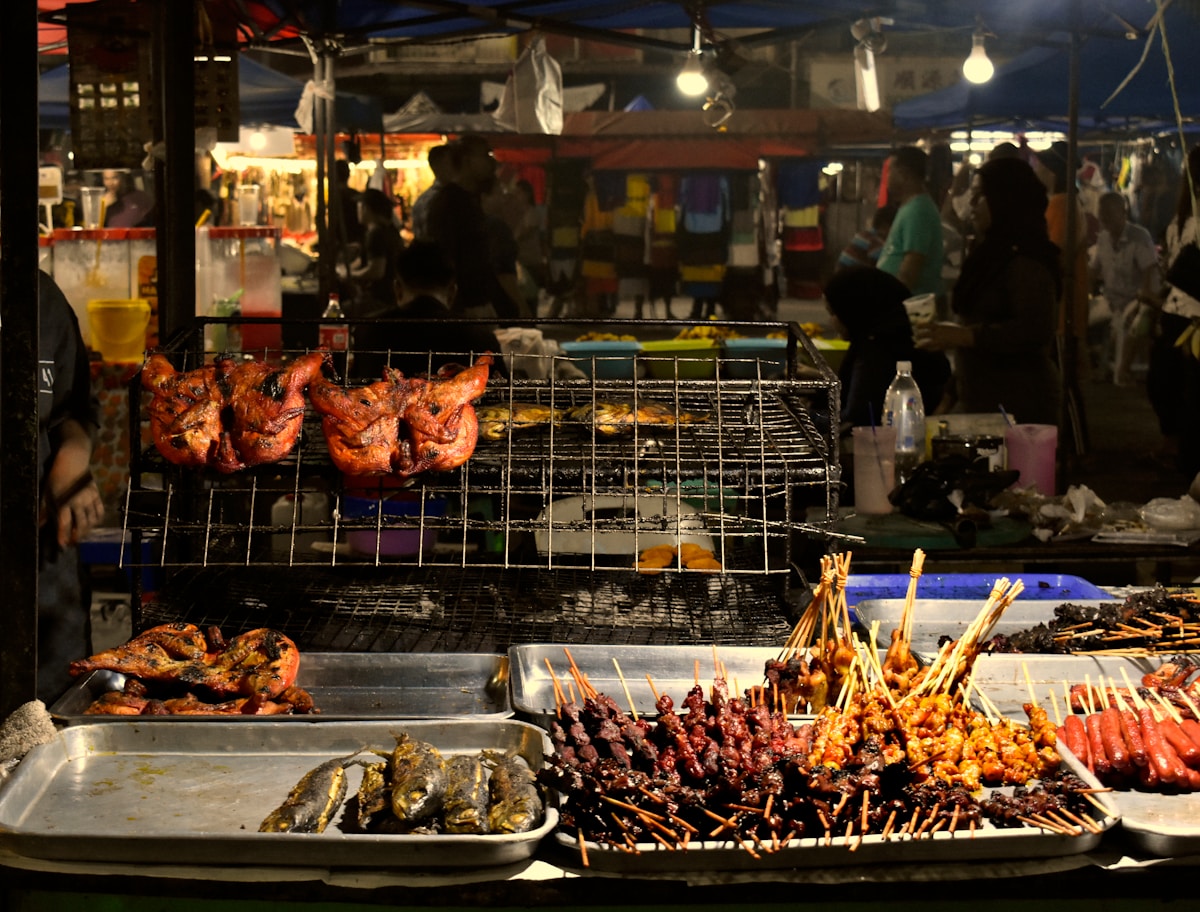 Man cooking at Malaysian hawker stall, Malaysia