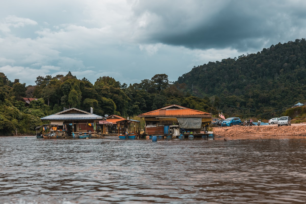 Wooden floating chalets moored on the Tembeling River at Taman Negara, Malaysia