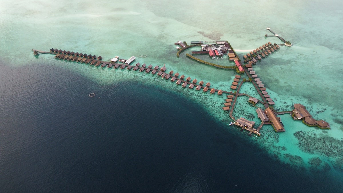 Island in ocean under cloudy sky, Sabah, Malaysia