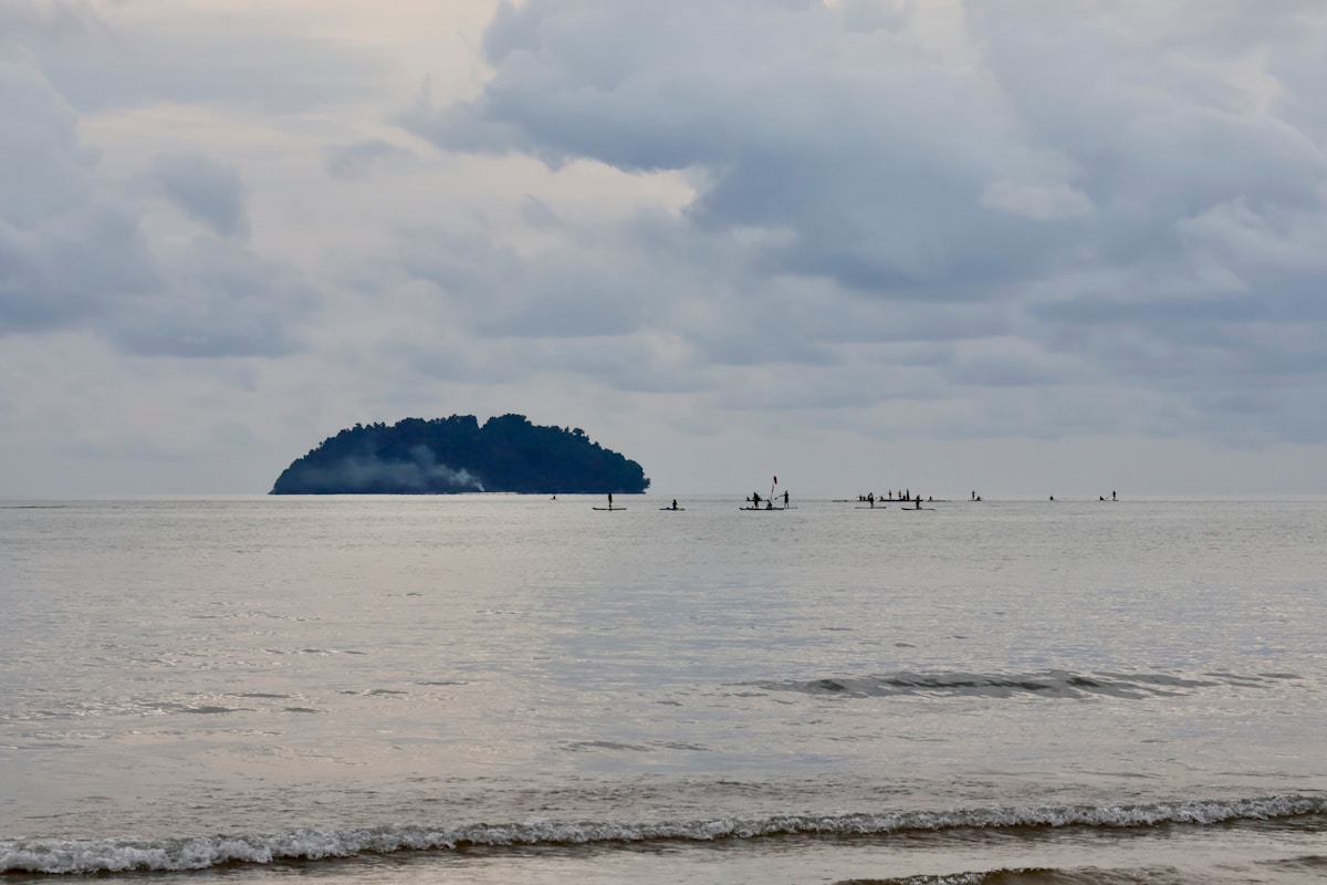 Small island in the ocean under cloudy sky, Sabah, Malaysia